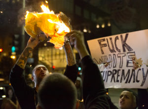 Demonstrators react to Donald Trumps presidential win by burning a Donald Trump piñata in downtown Los Angeles, Calif. on November 8, 2016. The night of protest continued into the early morning with a promise by demonstrators to return the next day. (Jose Lopez)