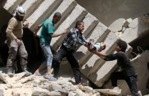 Syrian civil defence volunteers and rescuers remove a baby from under the rubble of a destroyed building following a reported air strike on the rebel-held neighbourhood of al-Kalasa in the northern Syrian city of Aleppo, on April 28, 2016. The death toll from an upsurge of fighting in Syria's second city Aleppo rose despite a plea by the UN envoy for the warring sides to respect a February ceasefire. / AFP PHOTO / AMEER ALHALBIAMEER ALHALBI/AFP/Getty Images